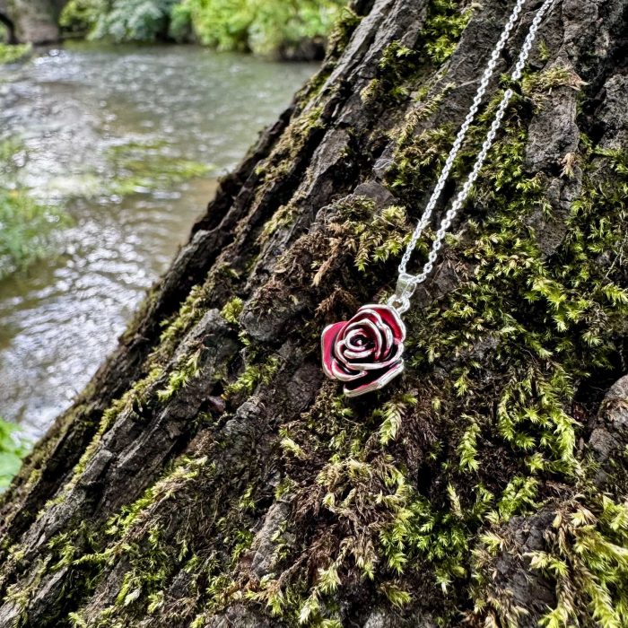 red-rose-flower-necklace-on-wood-alexander-thurlow-ath995